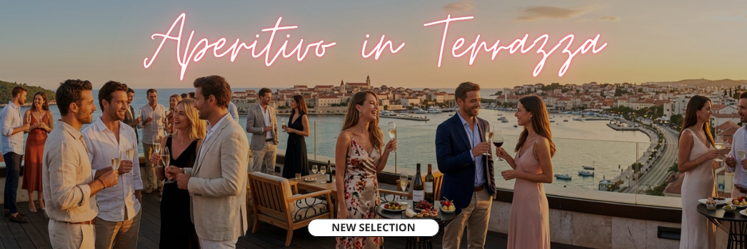 un gruppo di persone beve in terrazza sul mare